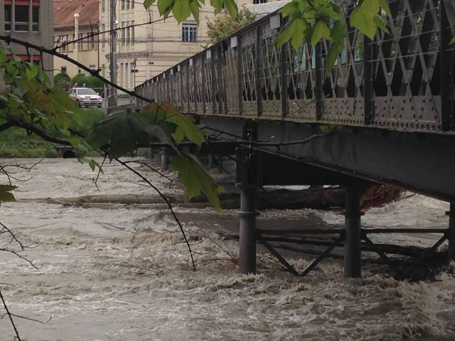Two large trees stuck under these pillars. This bridge is one of four closed due to the inundation & massive energy of the water on the Arve River